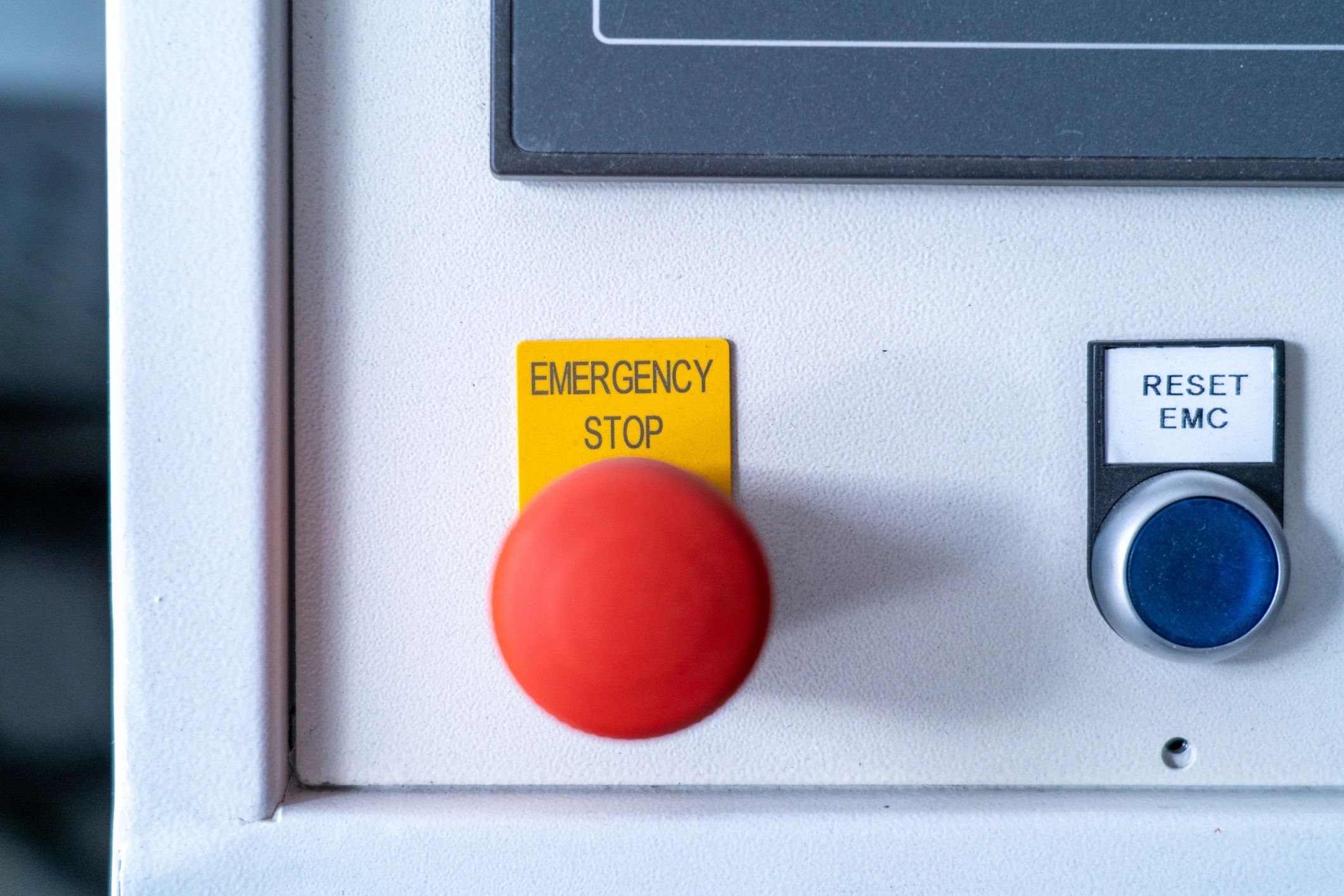 Industrial control panel with emergency stop and reset buttons